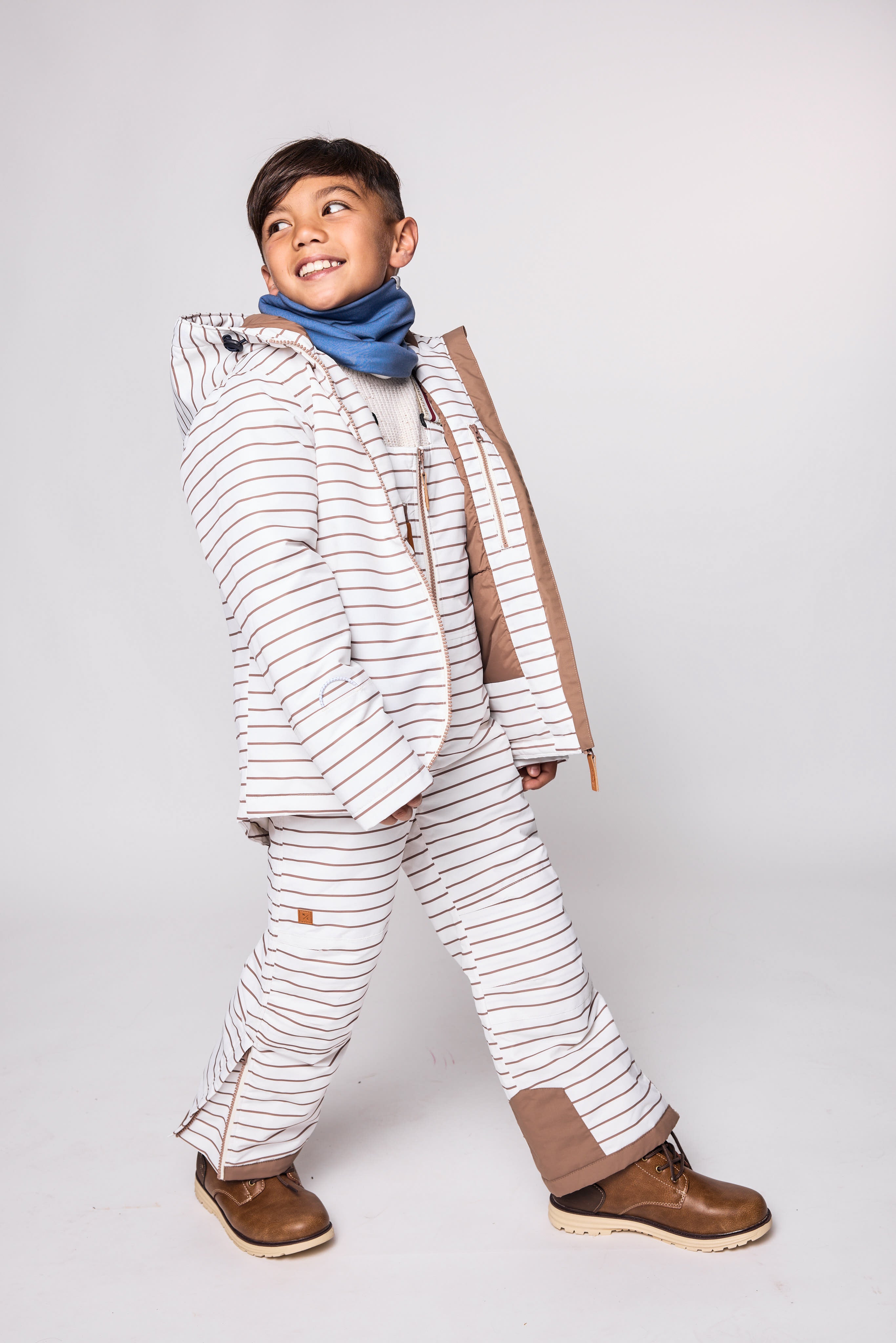 Kids striped brown and white snow bib pants with adjustable straps, waterproof fabric, and reinforced knees for winter play