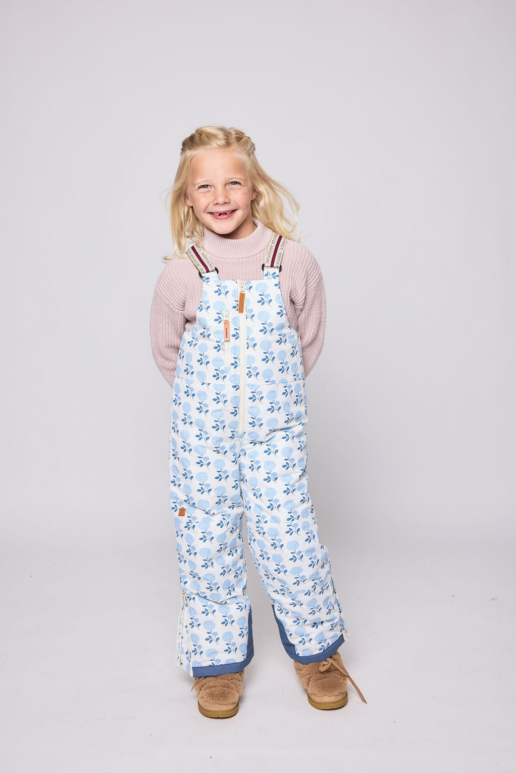 Kids blue floral snow bib pants with adjustable straps, waterproof fabric, and reinforced knees for winter play and ski for girls