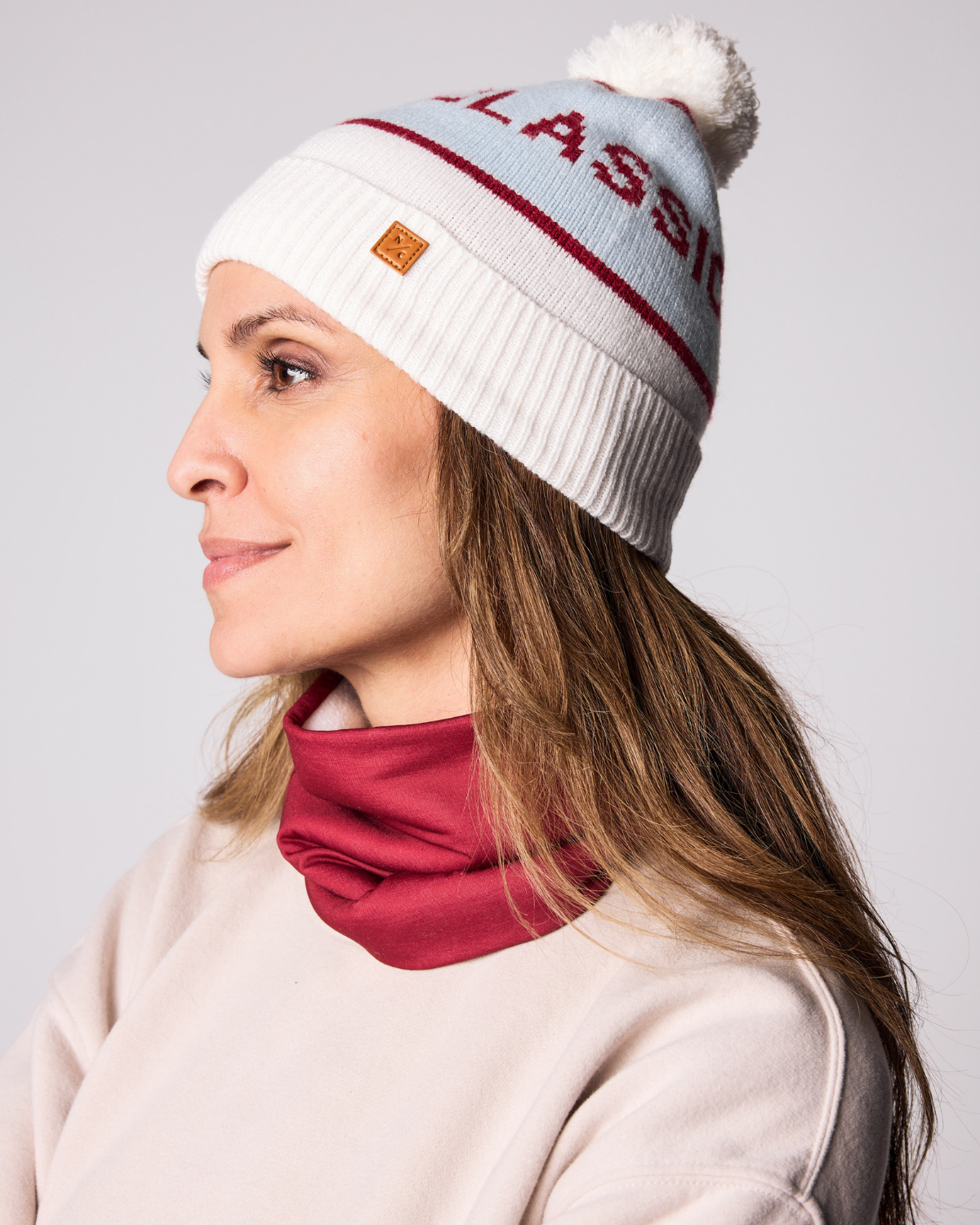 Kids and women's red fleece neck warmer for boys and girls, made with soft, breathable fabric to keep necks warm during outdoor play, skiing, and winter snow activities