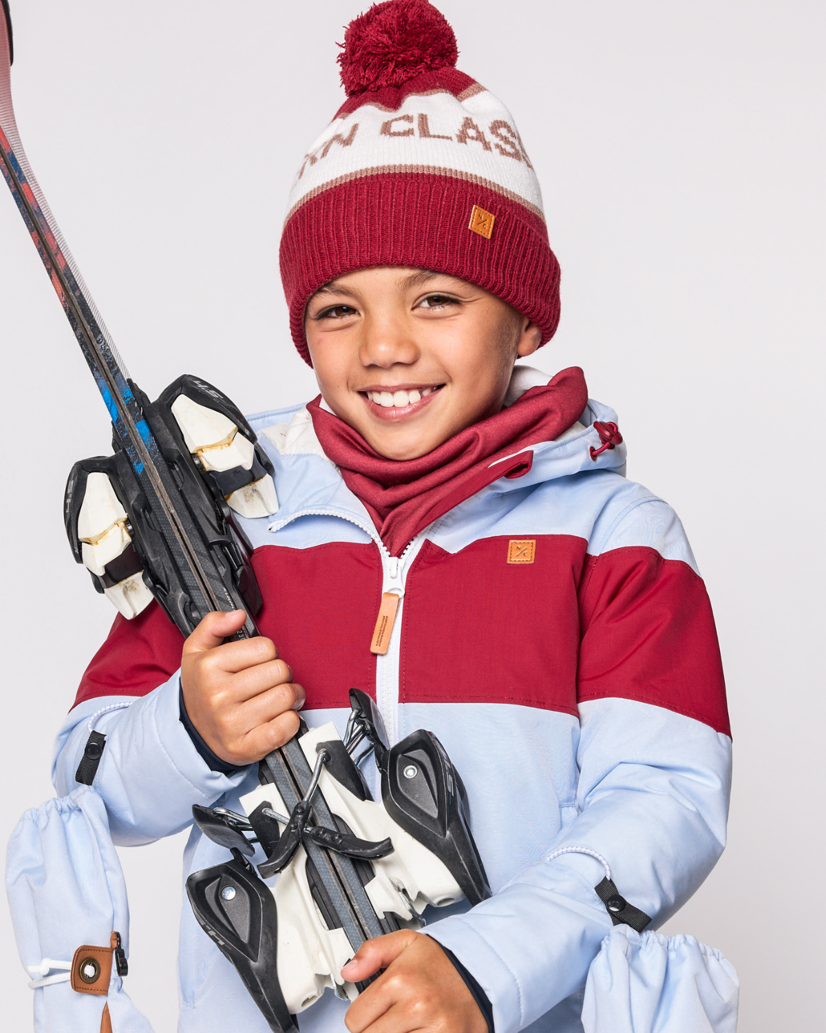 Kids and women's red fleece neck warmer for boys and girls, made with soft, breathable fabric to keep necks warm during outdoor play, skiing, and winter snow activities