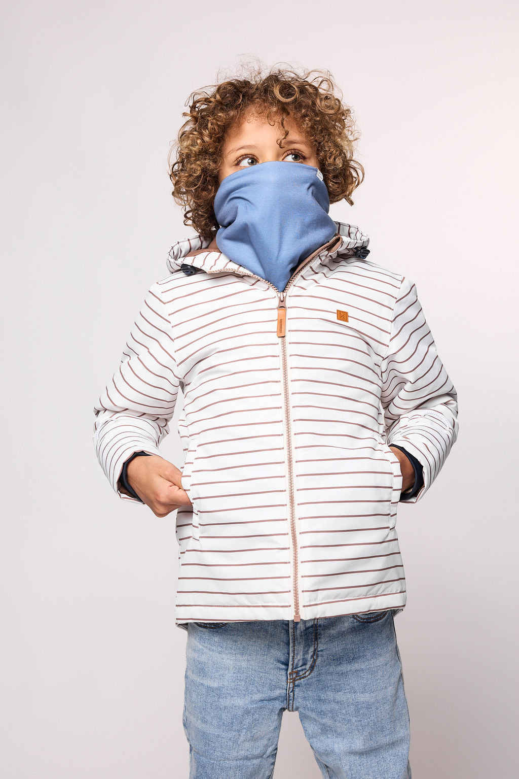 Kids striped brown and white winter coat for skiing and snow play, with warm insulation and waterproof outer shell for full cold weather protection and hood