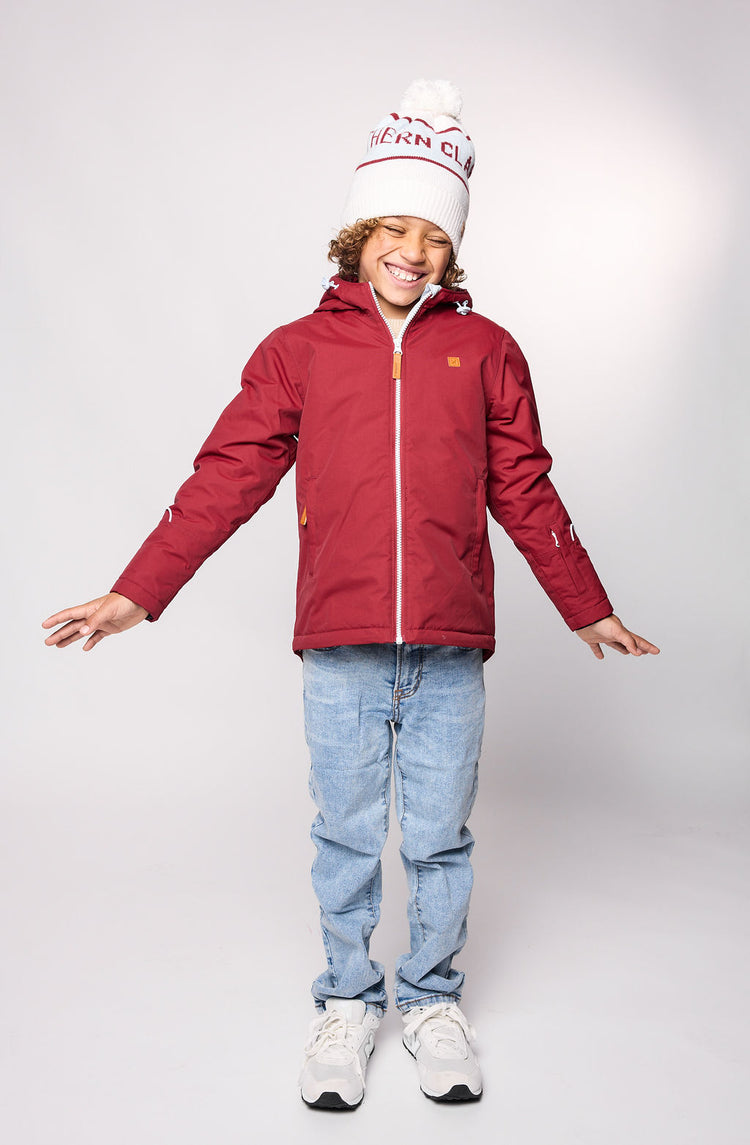 Kids red winter coat for skiing and snow play, with warm insulation and waterproof outer shell for full cold weather protection and hood