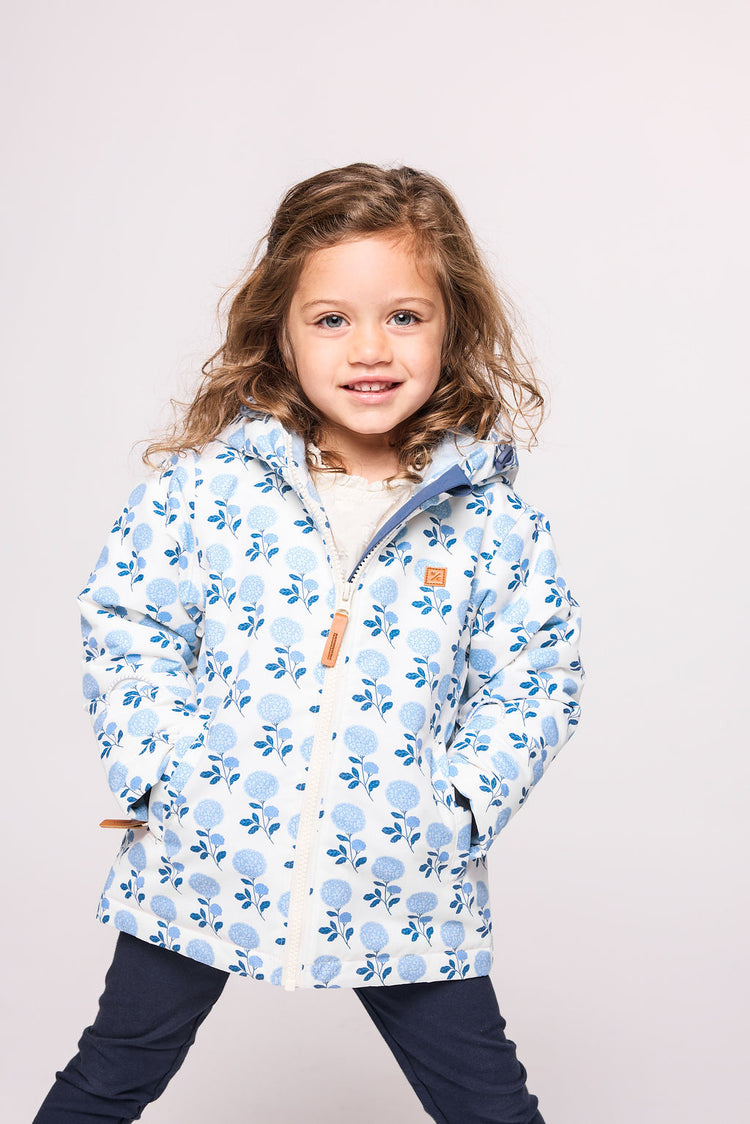 Girls and women blue floral hydrangea winter coat for skiing and snow play, with warm insulation and waterproof outer shell for full cold weather protection