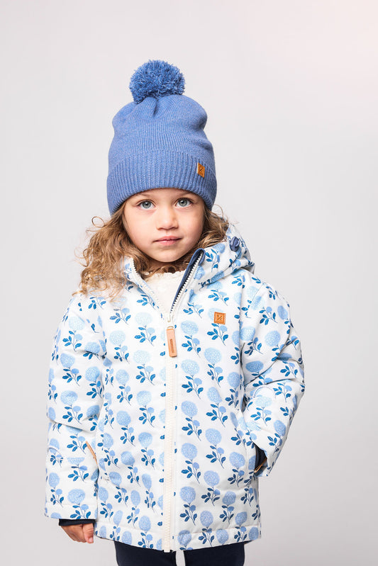Girls and women blue floral hydrangea winter coat for skiing and snow play, with warm insulation and waterproof outer shell for full cold weather protection
