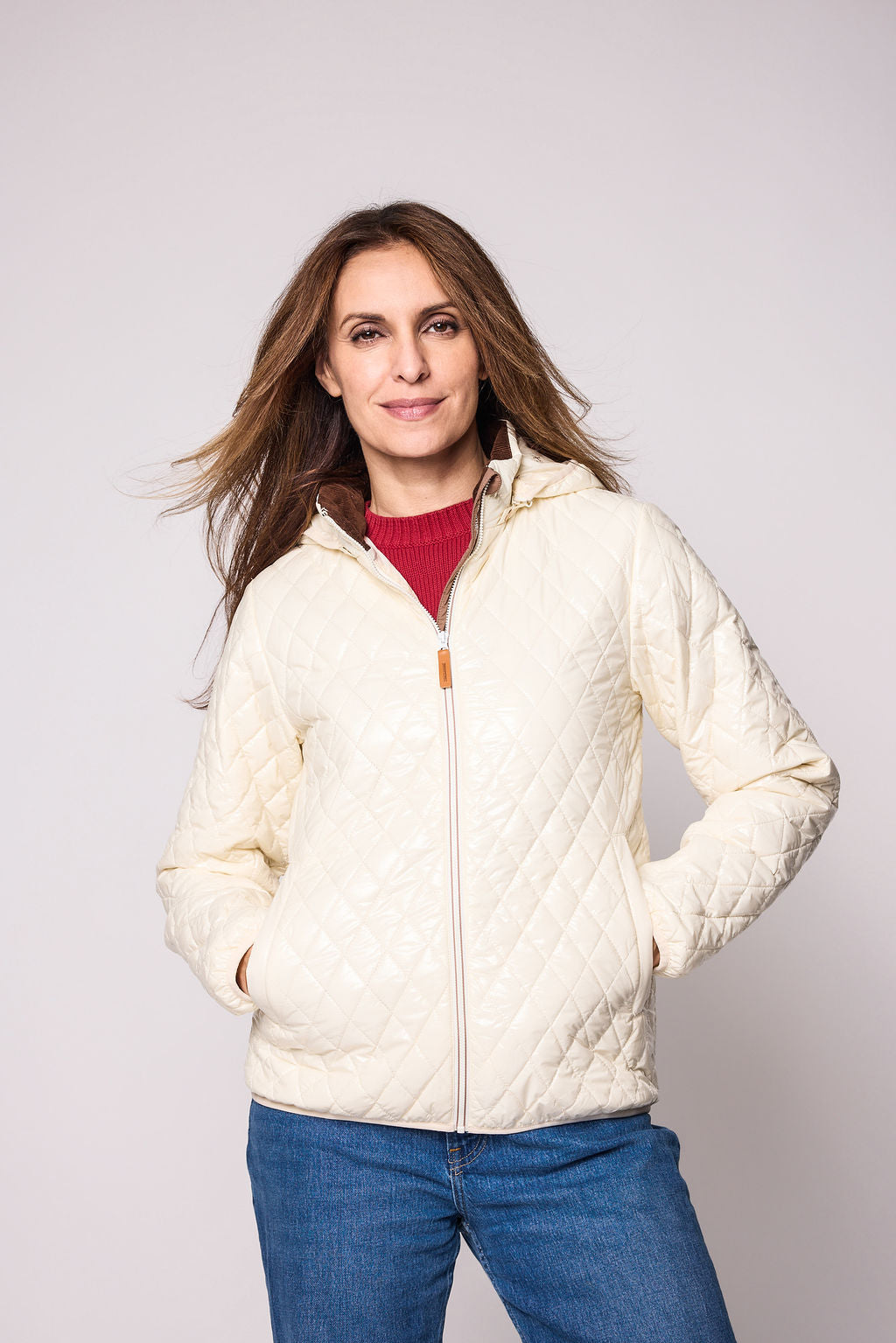 Women's shiny white puffer jacket for fall and winter with removable hood, insulated lining, and water-resistant outer shell