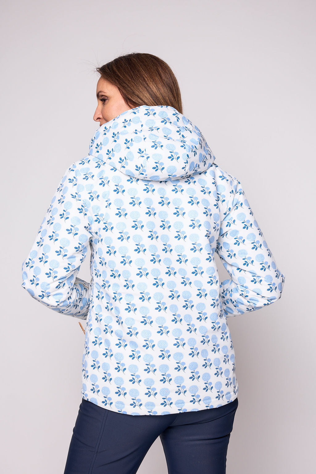 Girls and women blue floral hydrangea winter coat for skiing and snow play, with warm insulation and waterproof outer shell for full cold weather protection