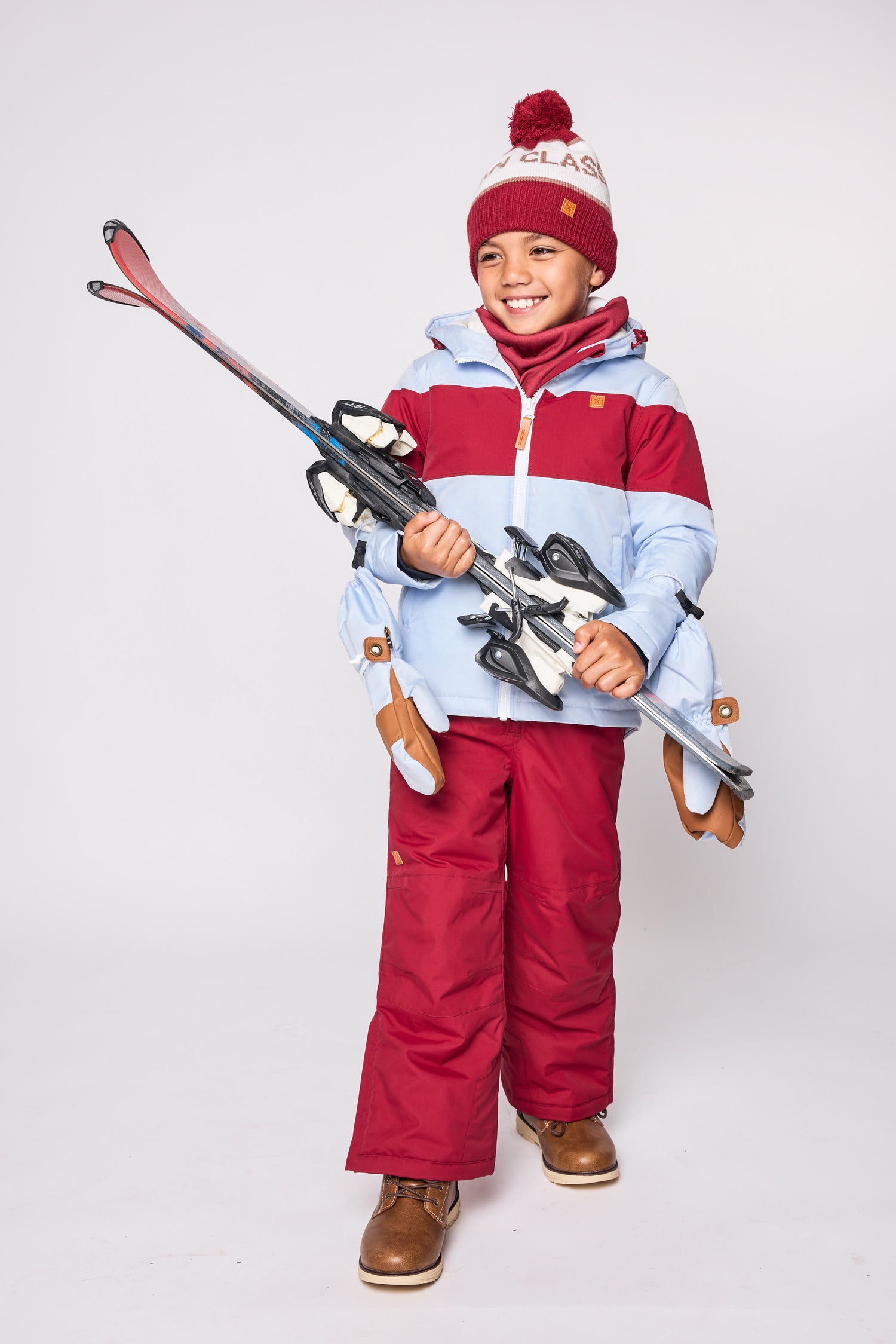 Kids red and light blue winter coat for skiing and snow play, with warm insulation and waterproof outer shell for full cold weather protection and hood