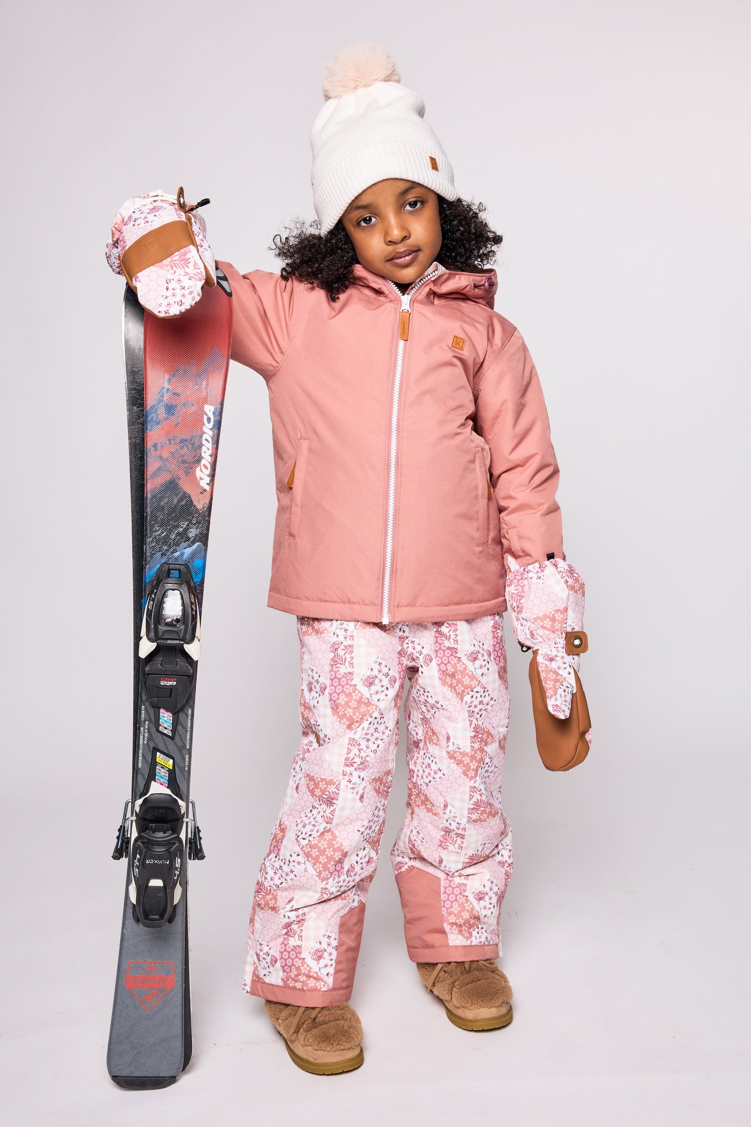 Girls pink winter coat for skiing and snow play, with warm insulation and waterproof outer shell for full cold weather protection and hood