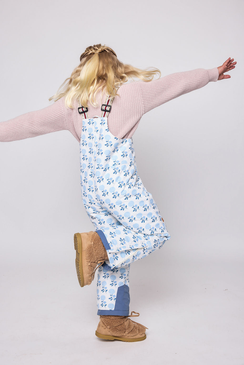 Kids blue floral snow bib pants with adjustable straps, waterproof fabric, and reinforced knees for winter play and ski for girls