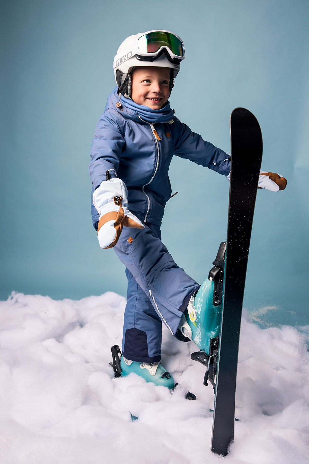 Kids blue winter coat for skiing and snow play, with warm insulation and waterproof outer shell for full cold weather protection and hood
