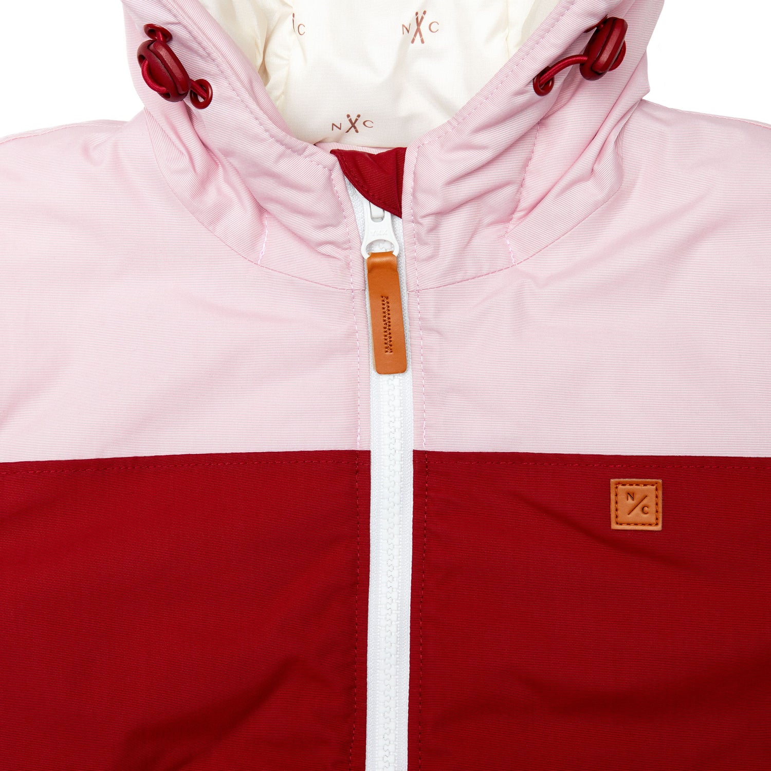 Kids red and light pink winter coat for skiing and snow play, with warm insulation and waterproof outer shell for full cold weather protection and hood