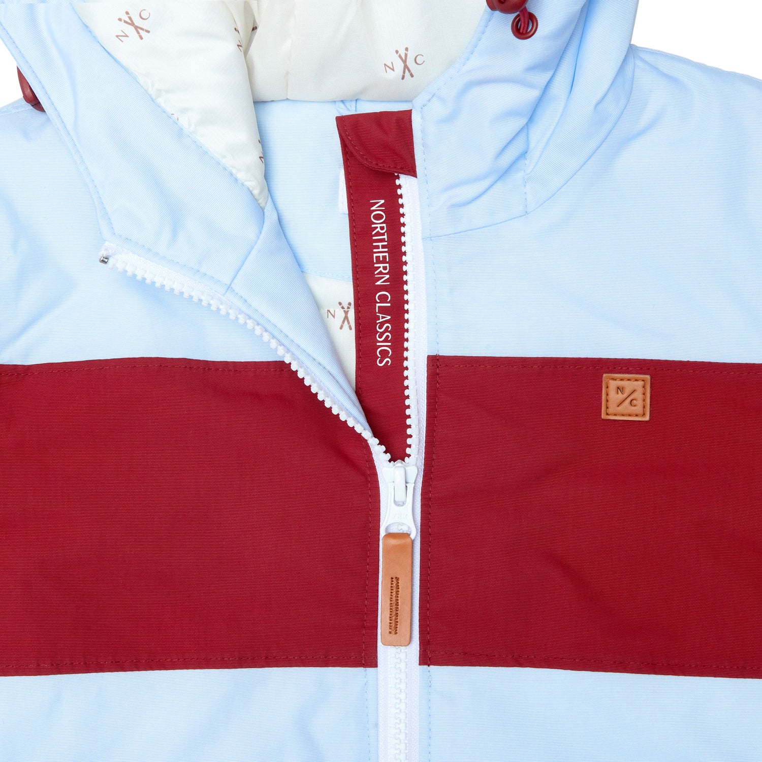 Kids red and light blue winter coat for skiing and snow play, with warm insulation and waterproof outer shell for full cold weather protection and hood