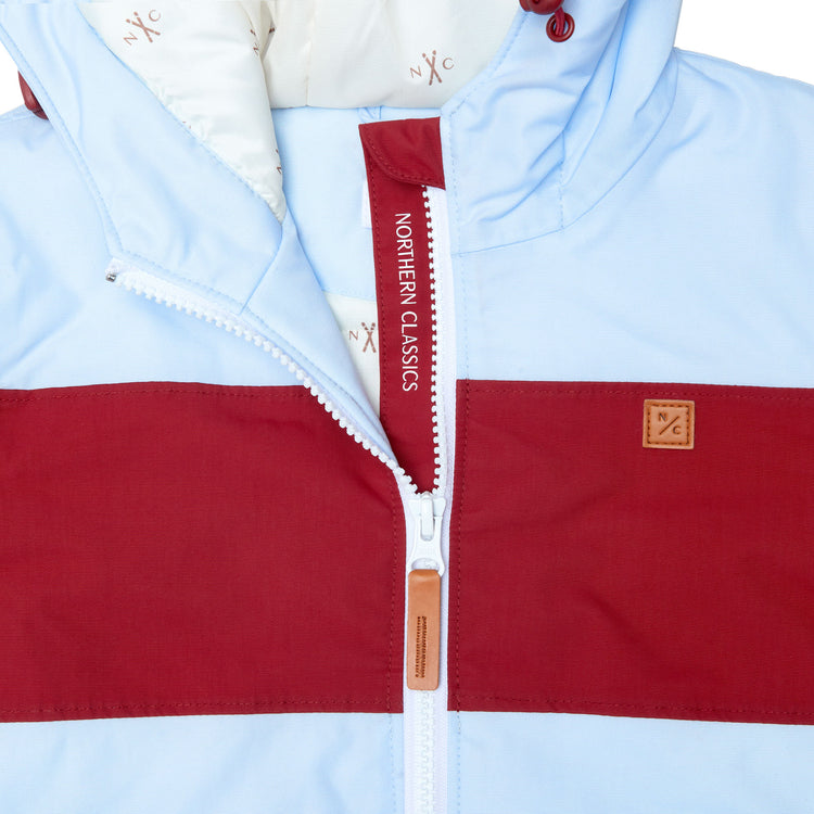 Kids red and light blue winter coat for skiing and snow play, with warm insulation and waterproof outer shell for full cold weather protection and hood
