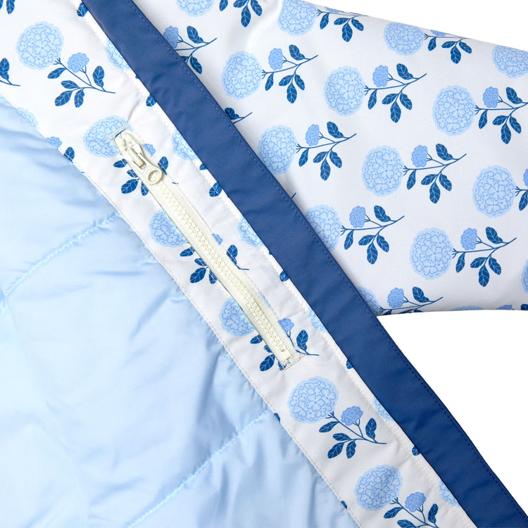 Girls and women blue floral hydrangea winter coat for skiing and snow play, with warm insulation and waterproof outer shell for full cold weather protection