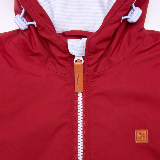Kids red winter coat for skiing and snow play, with warm insulation and waterproof outer shell for full cold weather protection and hood