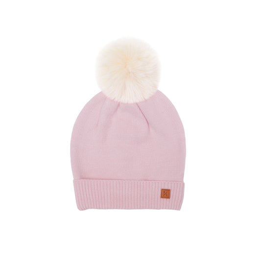 Classic Knit Pom Pom Hat for Kids and Women’s sizes in light pink crafted with soft knit fabric, luxe faux fur pom detail, and winter-ready durability for everyday adventures. It's so soft it feels like cashmere.