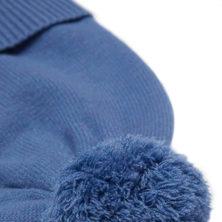 Classic Knit Pom Pom Hat for Kids and Women’s sizes in blue crafted with soft knit fabric, luxe faux fur pom detail, and winter-ready durability for everyday adventures. It's so soft it feels like cashmere.
