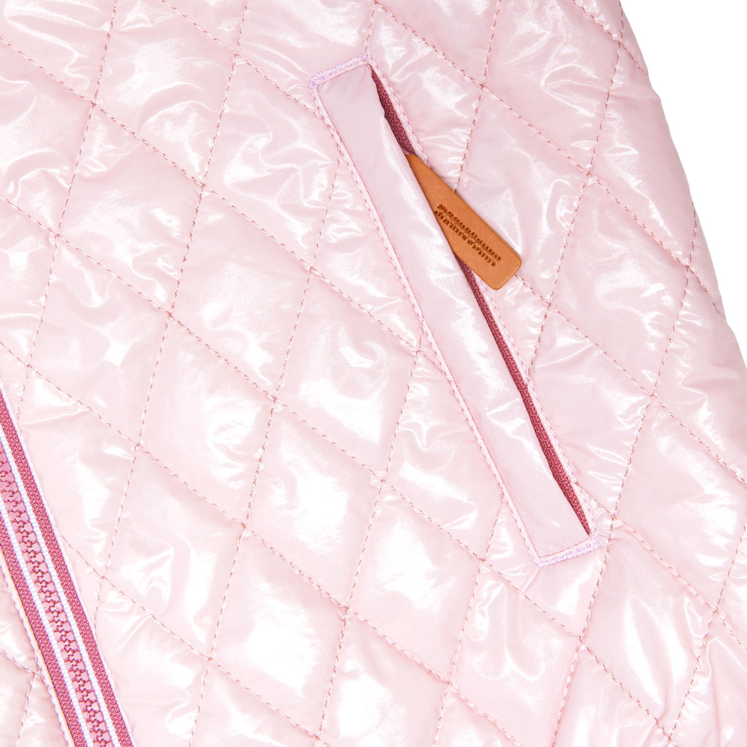 Girls and women shiny light pink puffer jacket for fall and winter, designed as a warm in-between layer with removable hood, insulated core, and water-resistant fabric
