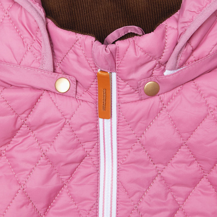 Girls and women pink puffer jacket for fall and winter, designed as a warm in-between layer with removable hood, insulated core, and water-resistant fabric