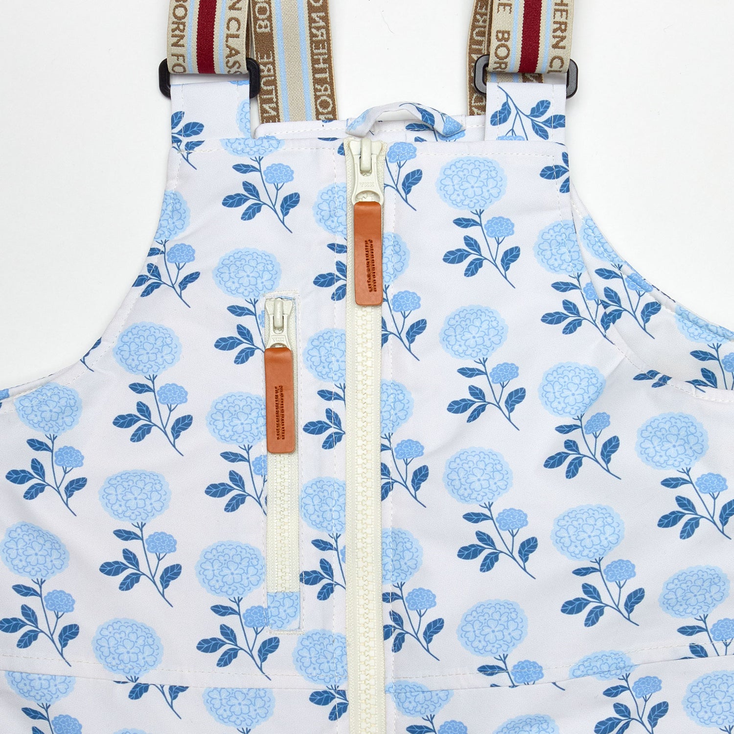 Kids blue floral snow bib pants with adjustable straps, waterproof fabric, and reinforced knees for winter play and ski for girls